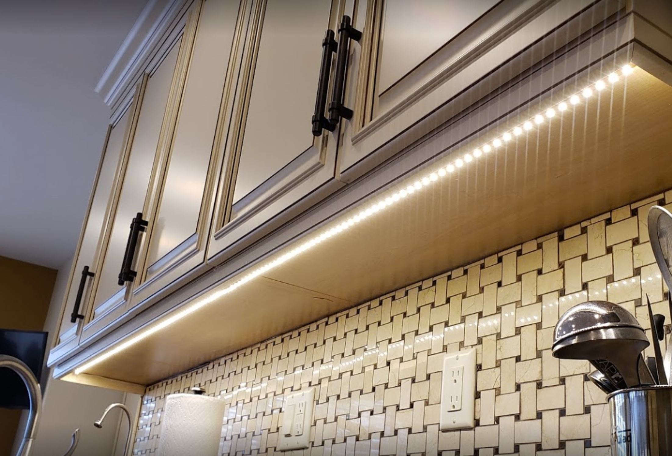 Finished kitchen with under-cabinet LED lighting installed by Bright Ideas Electric